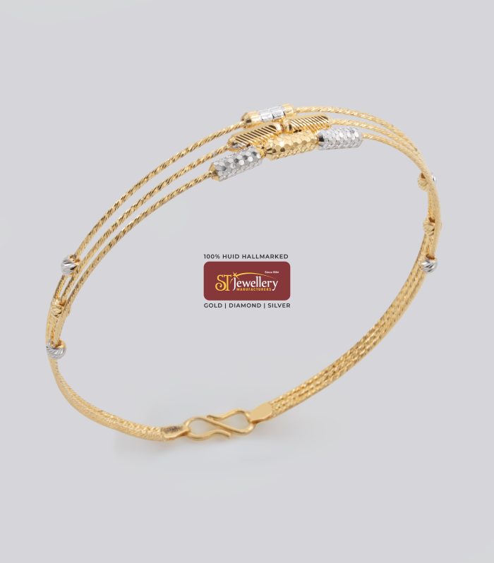 Elegant lightweight gold bangle with dual tone diamond cut pattern