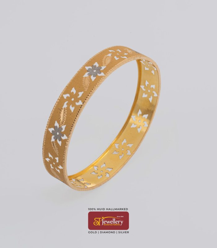Elegant gold bangle with floral cutwork pattern – lightweight gold jewellery by ST Jewellery Manufacturers Thrissur Kerala