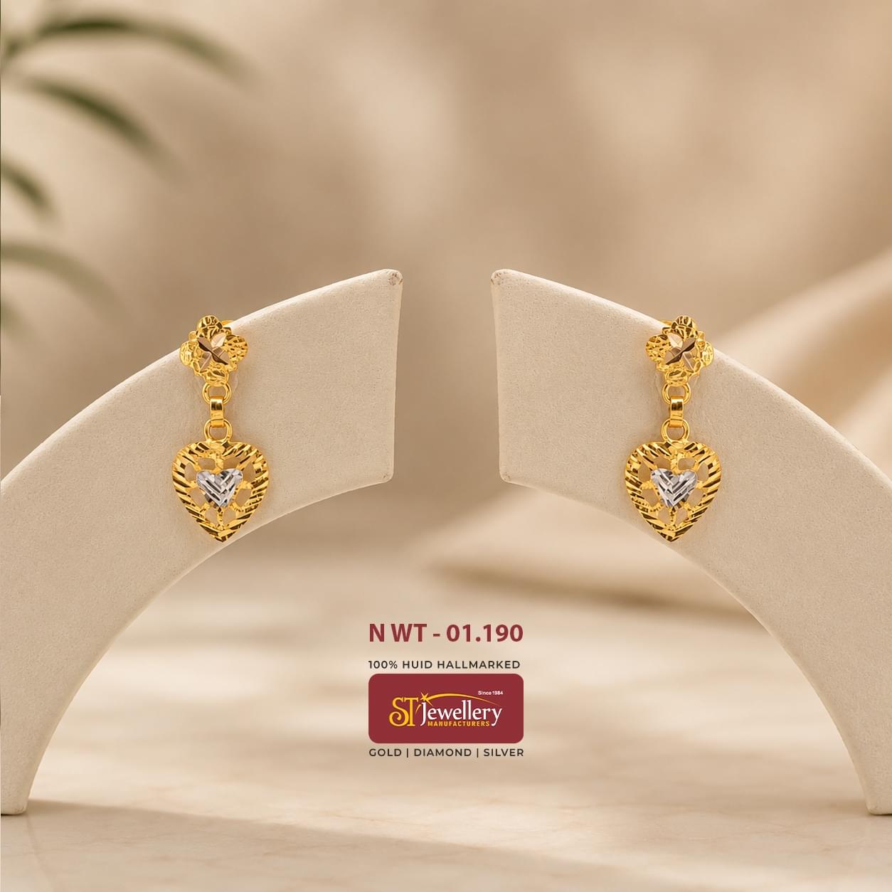 Lightweight heart-shaped gold drop earrings with elegant dual-tone detailing and intricate cutwork design, perfect for daily wear and gifting.