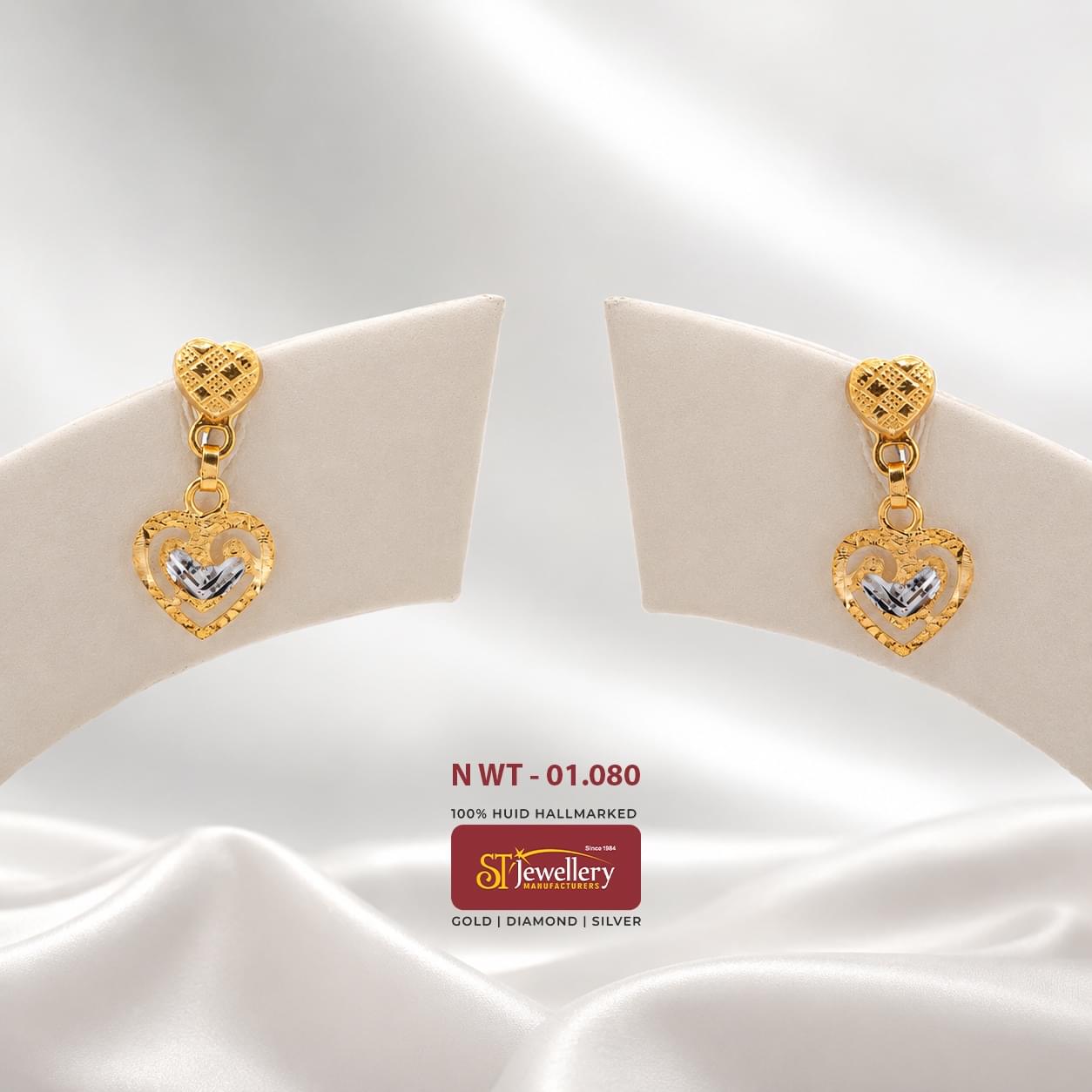 Lightweight heart-shaped gold drop earrings with elegant dual-tone detailing and textured finish, perfect for daily wear and gifting.