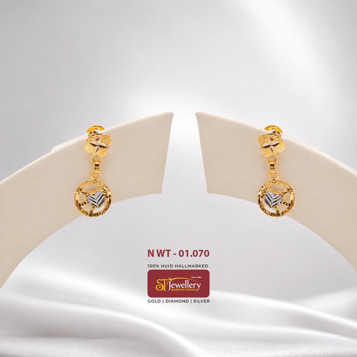 Elegant round gold drop earrings with dual-tone heart motif and intricate textured detailing, perfect for daily wear and special occasions.