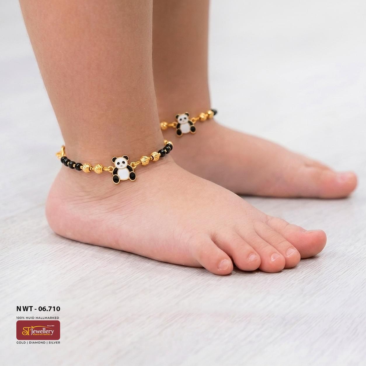 Kids gold and black bead anklet featuring an adorable panda charm with decorative gold bead accents and traditional craftsmanship.