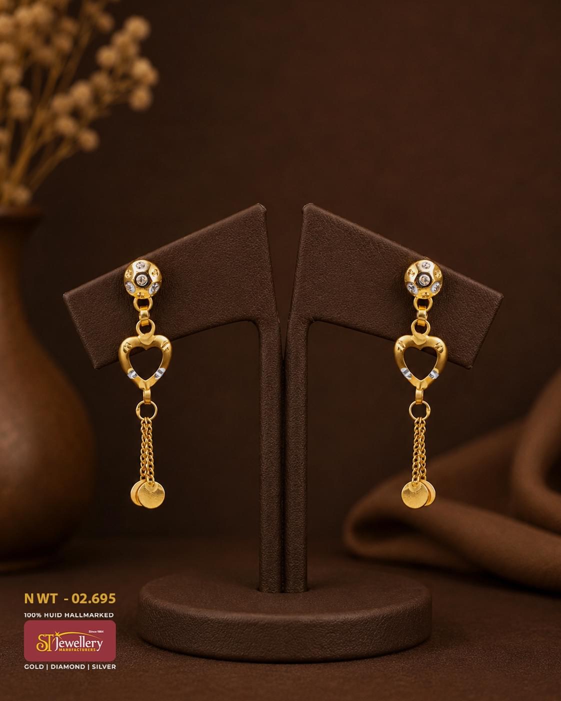 Elegant gold heart drop earrings with sparkling white stones and dangling coin tassels, perfect for festive, wedding, and party wear.