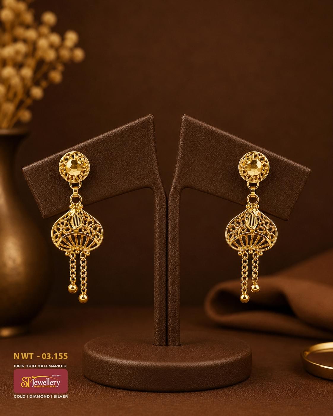 Elegant gold filigree drop earrings with intricate openwork design and dangling chain tassels, perfect for festive, wedding, and party wear.
