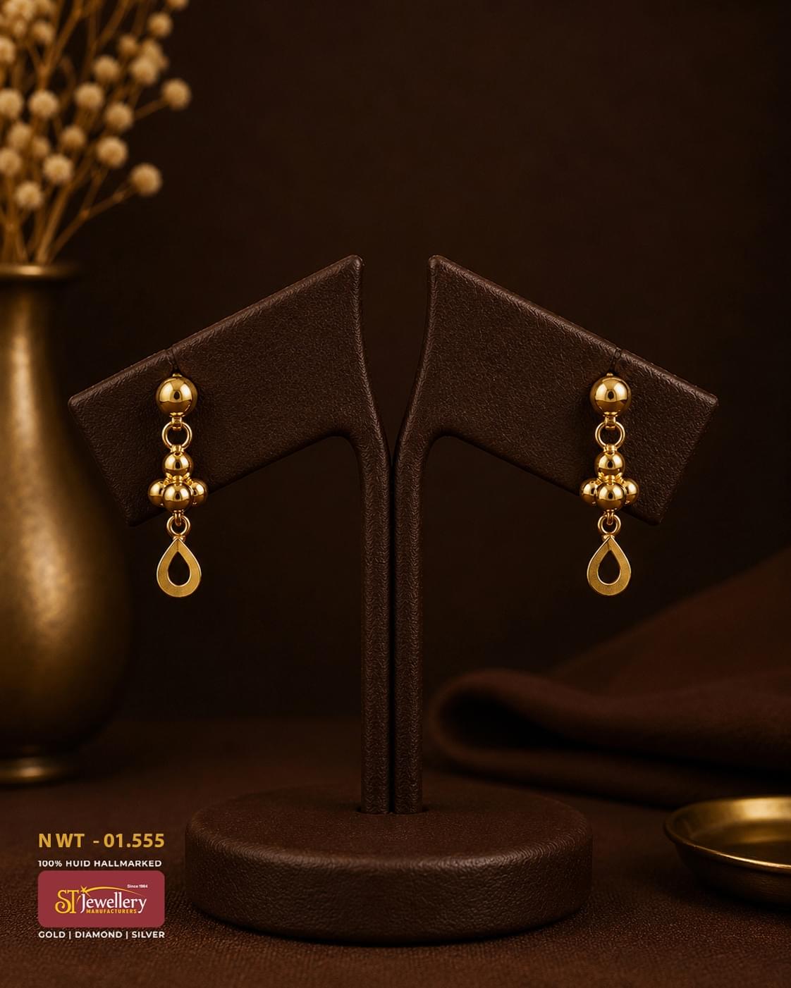 Minimalist gold drop earrings featuring polished gold bead accents and elegant open teardrop dangles, perfect for everyday wear and festive occasions.