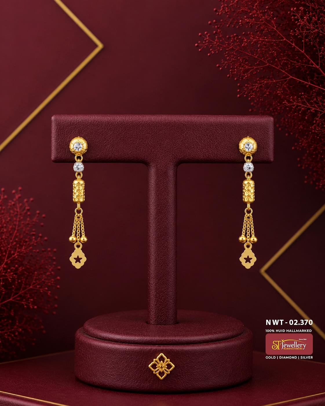 Elegant gold drop earrings featuring sparkling stone studs, textured cylindrical gold accents, delicate chain tassels, and floral charm drops, perfect for daily wear, festive occasions, and party styling.