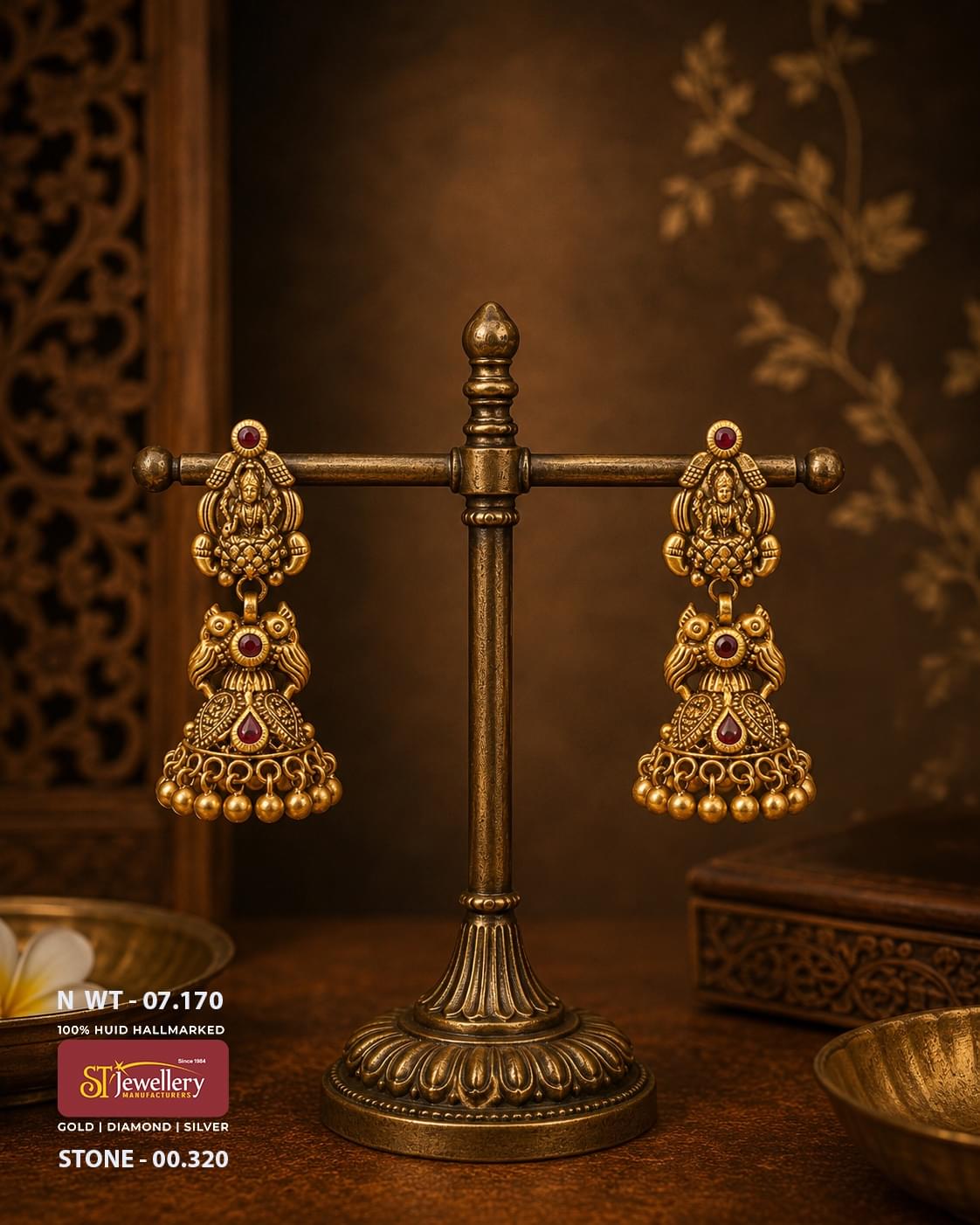 Antique temple gold jhumka earrings featuring Goddess Lakshmi motifs, ruby red stone accents, traditional South Indian handcrafted bridal temple jewellery with gold bead danglers.