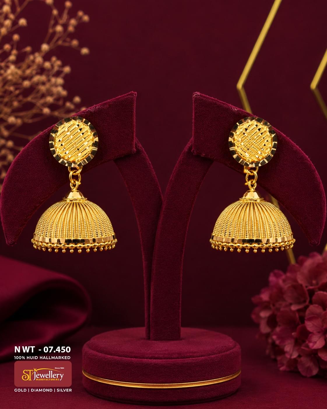 Traditional textured gold jhumka earrings with engraved round studs, handcrafted ribbed dome design, and elegant South Indian gold jewellery.