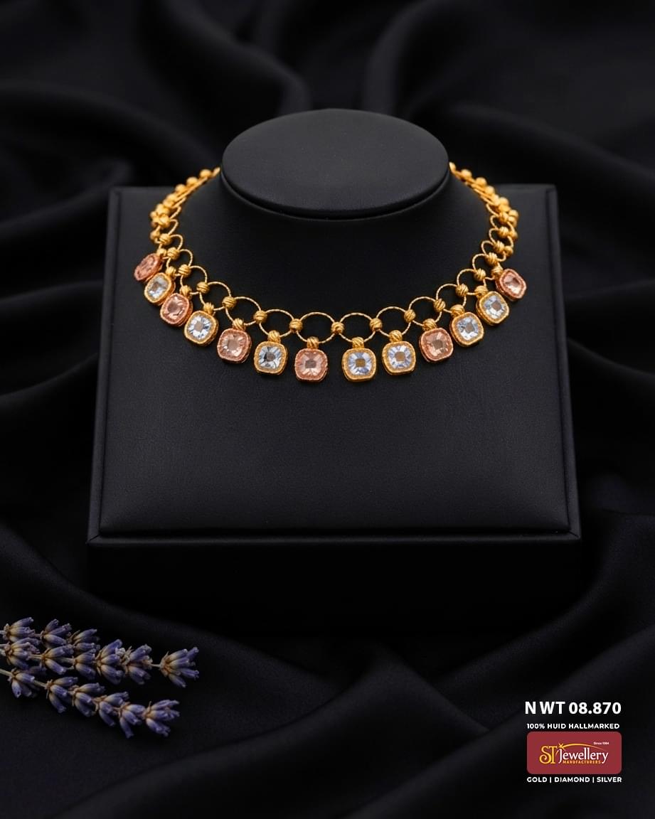 Lightweight gold necklace with circular link design and alternating rose gold and white gold square dangling motifs for women.