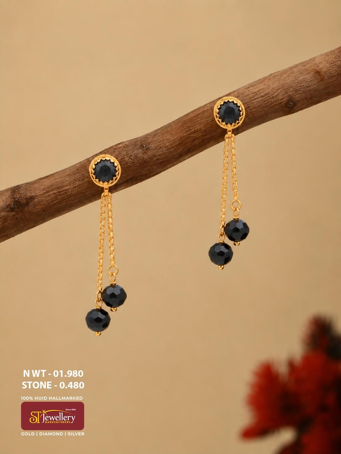 Lightweight gold drop earrings with black faceted beads, round black stone studs and delicate double-chain drops.