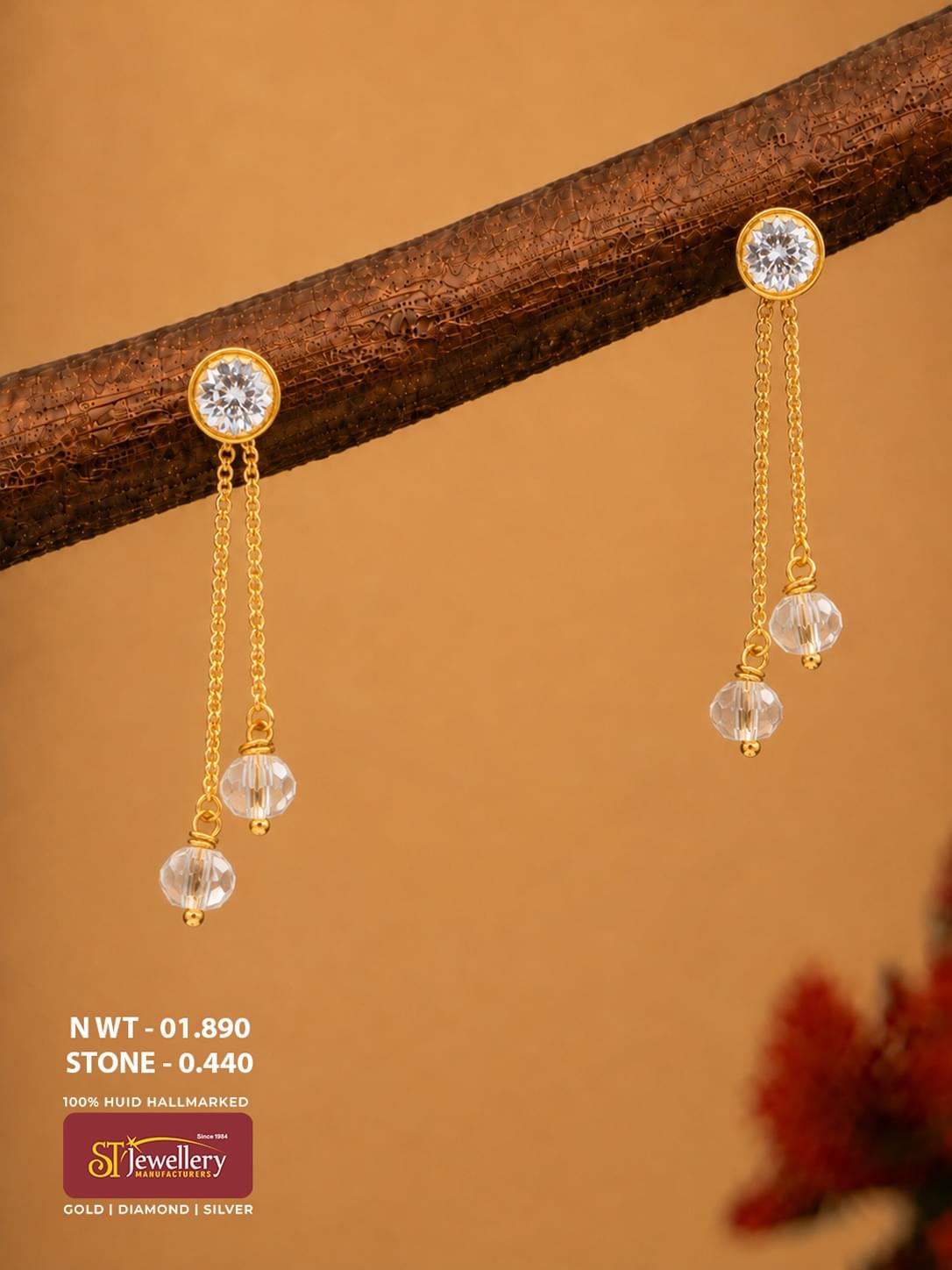 Lightweight gold chain drop earrings with clear stone studs and faceted crystal bead hangings for women.