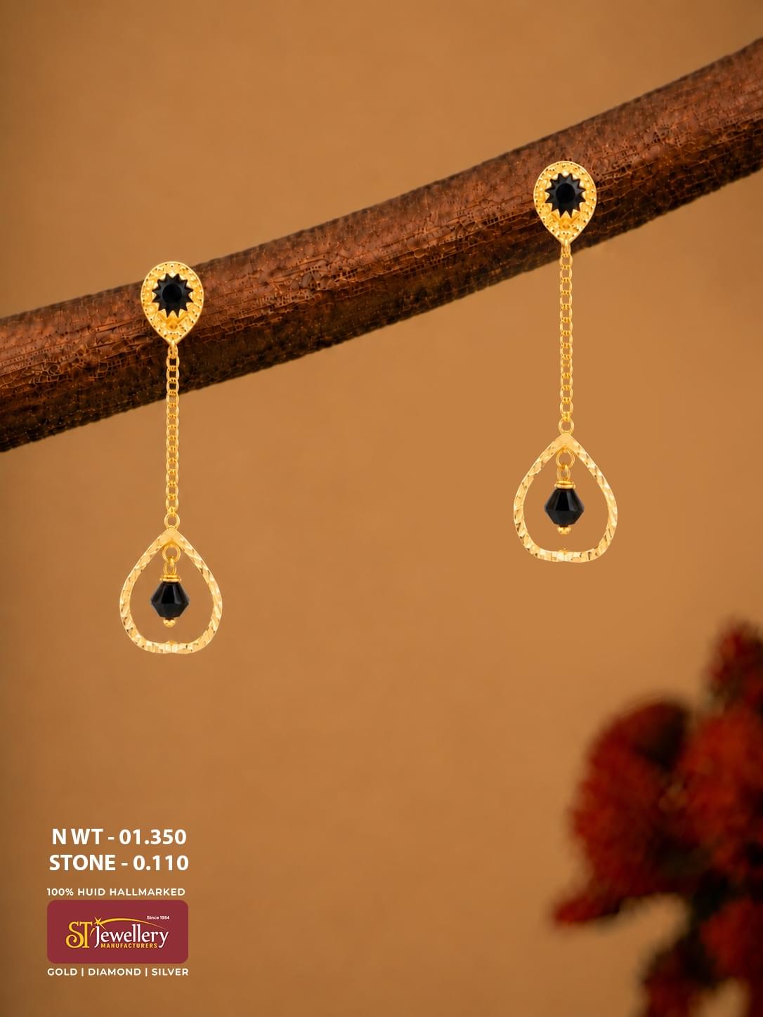 Lightweight gold chain drop earrings with black stones and teardrop-shaped hanging design for women.