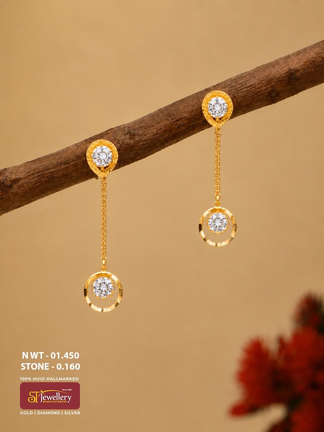 Lightweight gold chain drop earrings with sparkling clear stones, teardrop-shaped stud tops and circular dangling motifs.