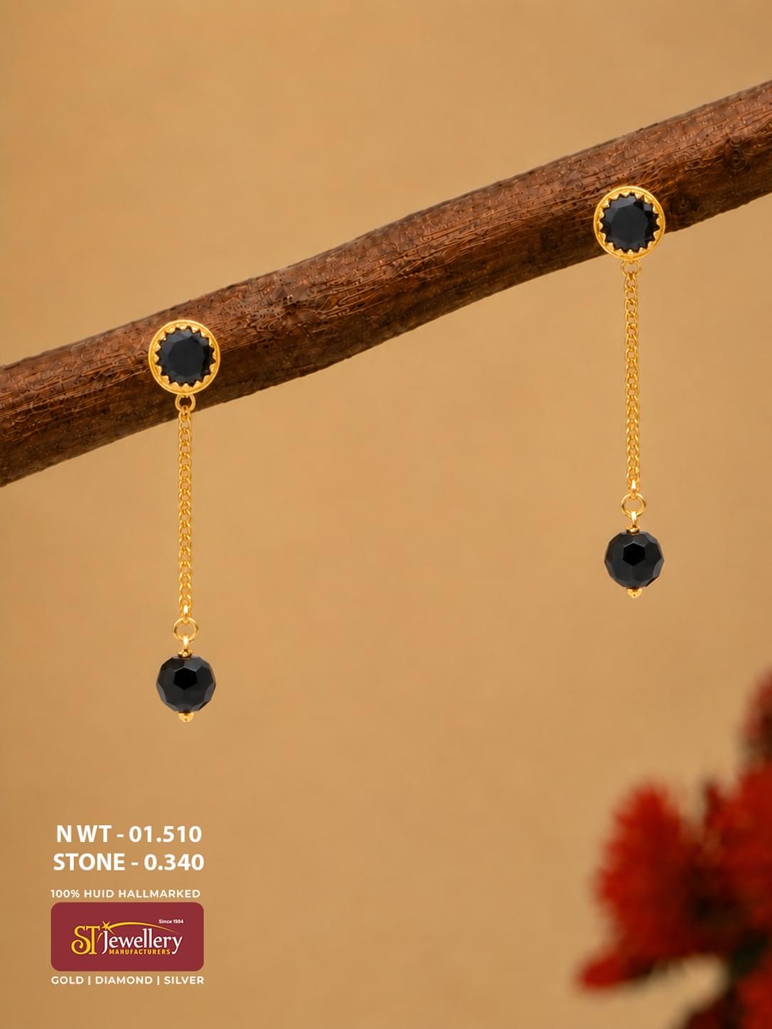 Lightweight gold chain drop earrings with round black stone studs and single faceted black bead drops.