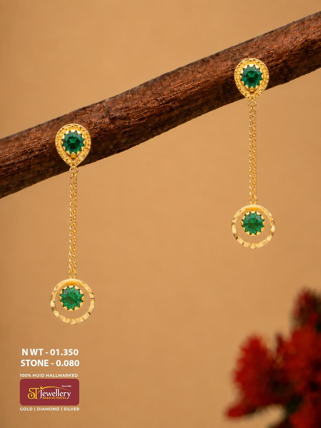 Lightweight gold chain drop earrings with teardrop-shaped green stone studs and circular green stone hanging motifs.