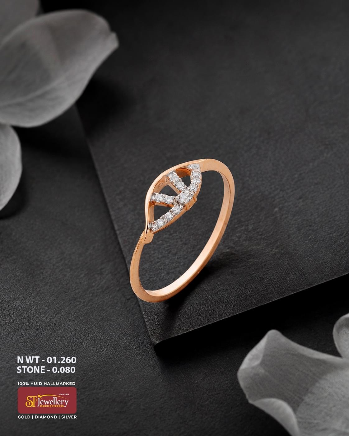 916 HUID hallmarked rose gold ring with an elegant leaf-inspired openwork design accented with sparkling white stones.