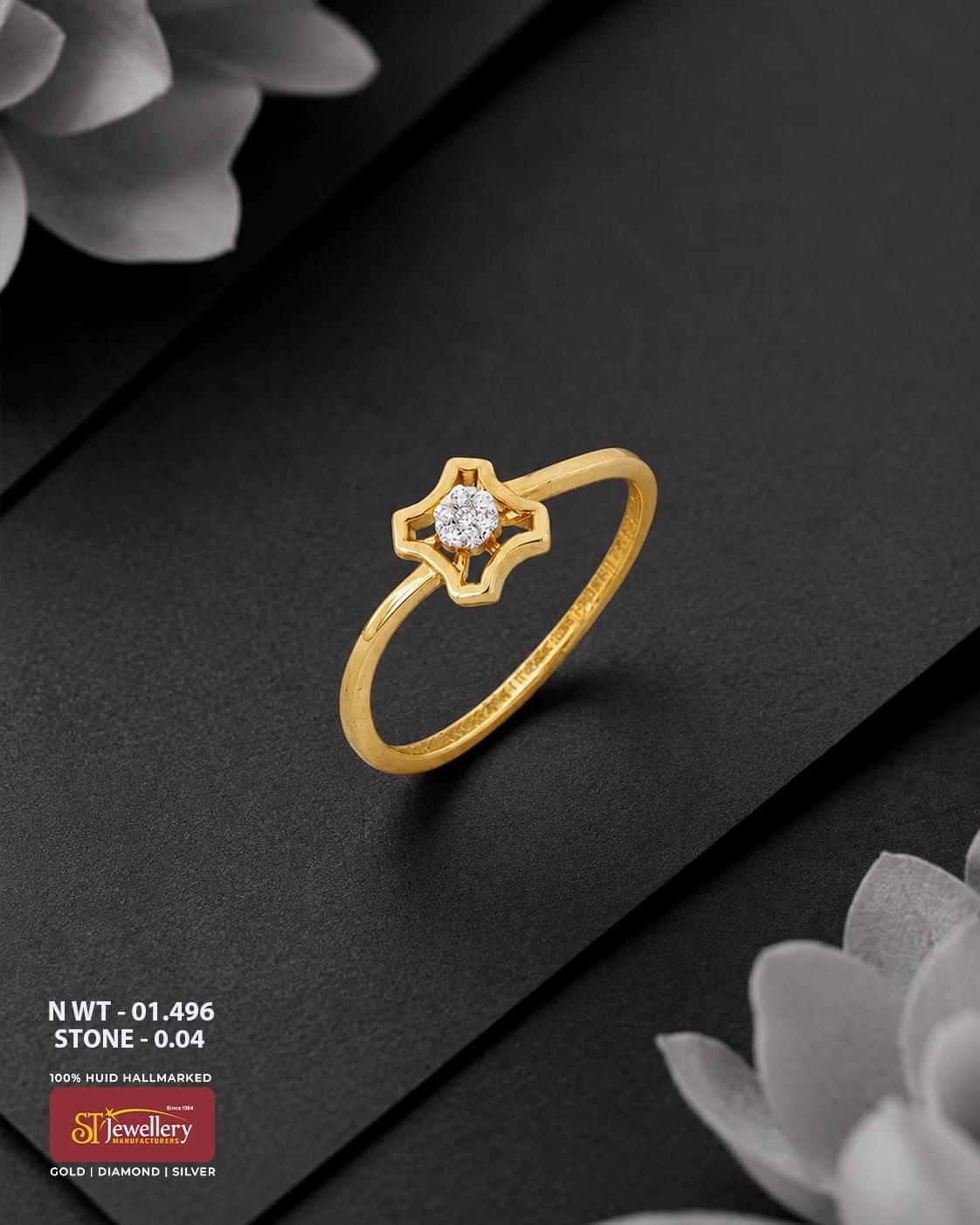 916 HUID hallmarked yellow gold ring featuring a geometric star-inspired openwork design with a sparkling white stone cluster at the centre.