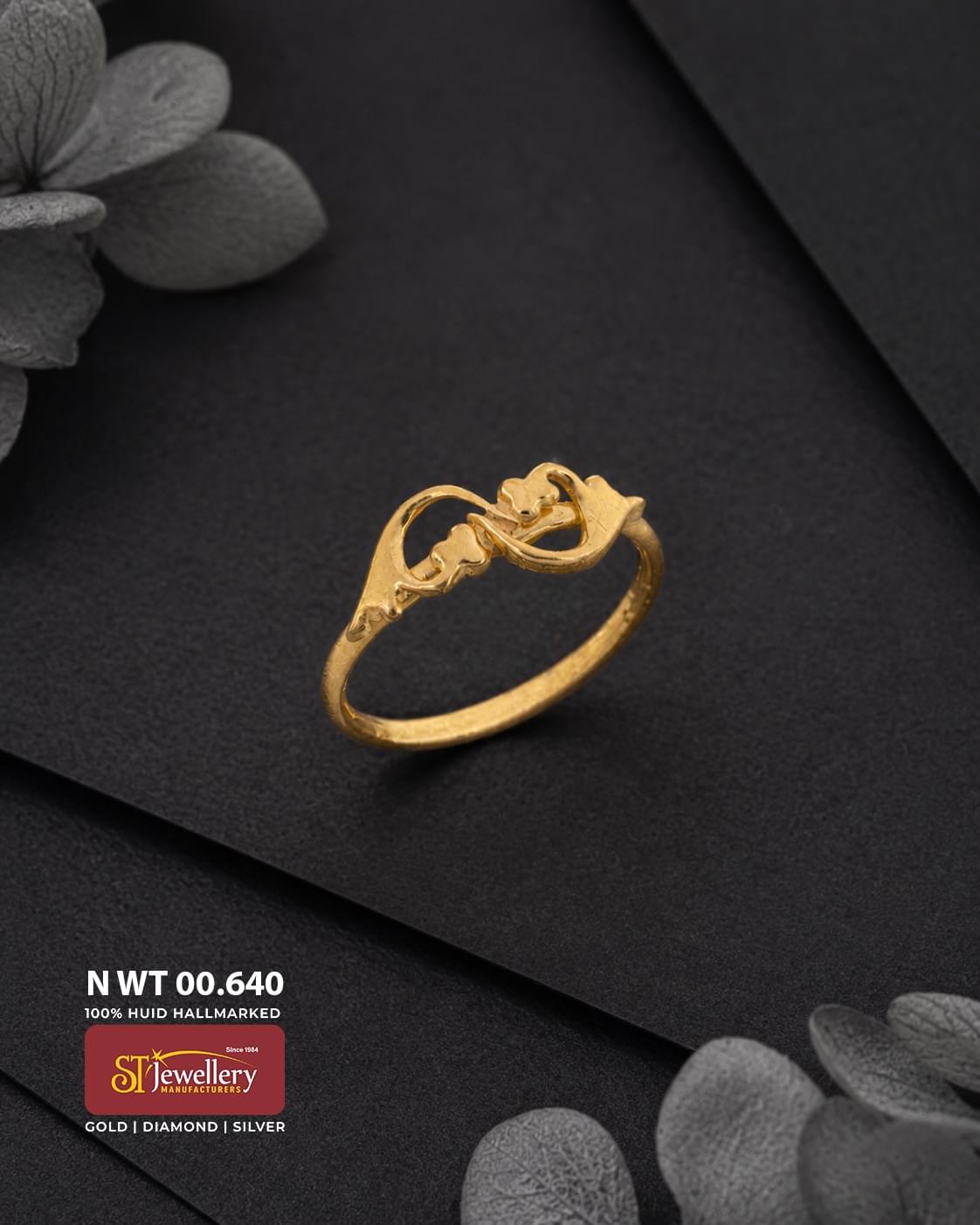 Lightweight gold ring featuring an elegant openwork floral and curved motif design, displayed on a premium matte black background.
