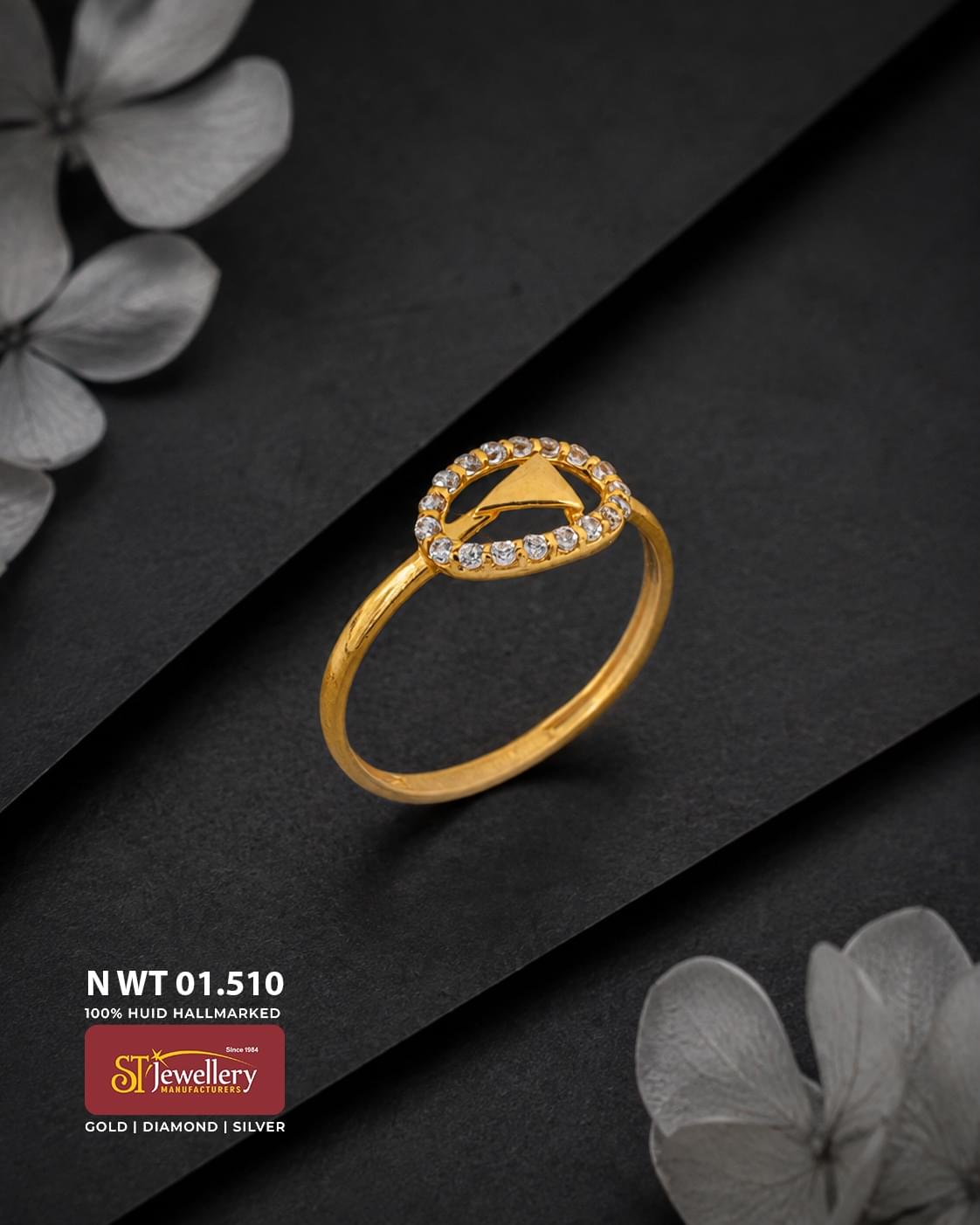 Elegant gold ring with a circular clear stone border and a modern triangular gold motif at the centre, designed for stylish daily wear.
