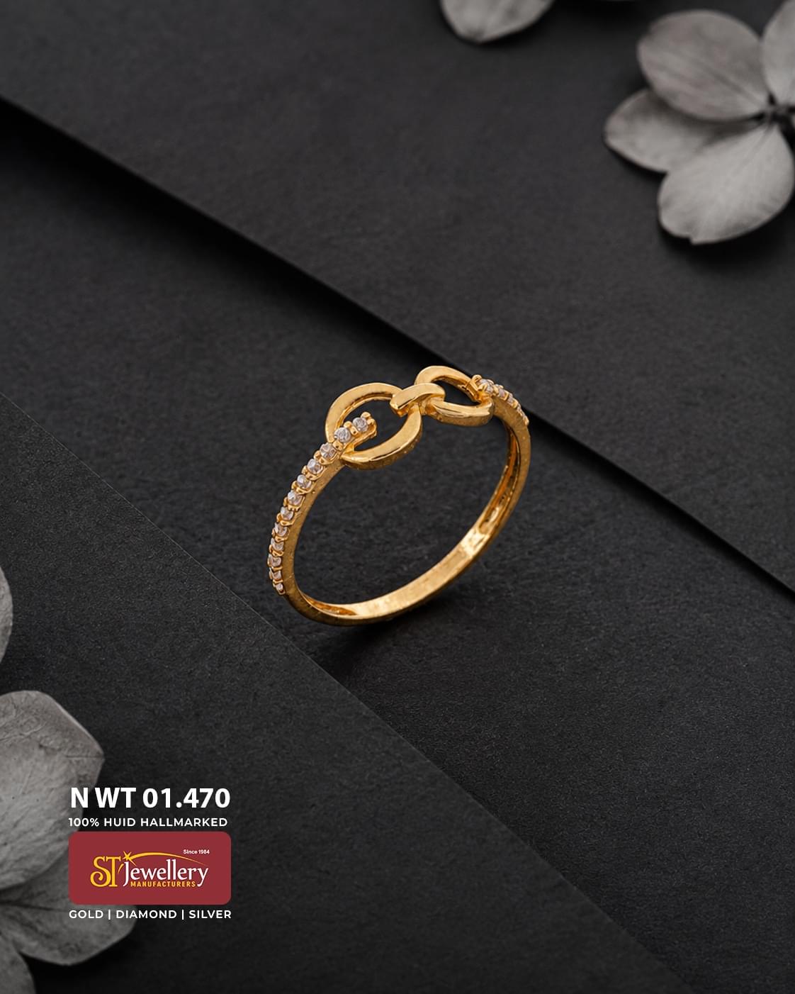 Elegant gold ring featuring an interlocking circular design with sparkling clear stone accents along the slim band, ideal for stylish daily wear.