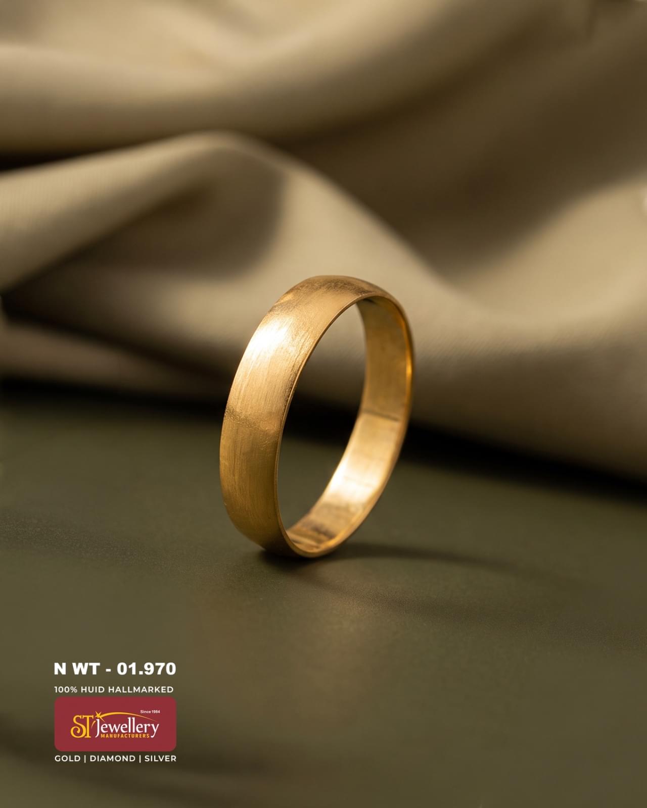 Simple plain gold band ring with a smooth brushed finish, featuring a clean minimalist design for everyday wear.