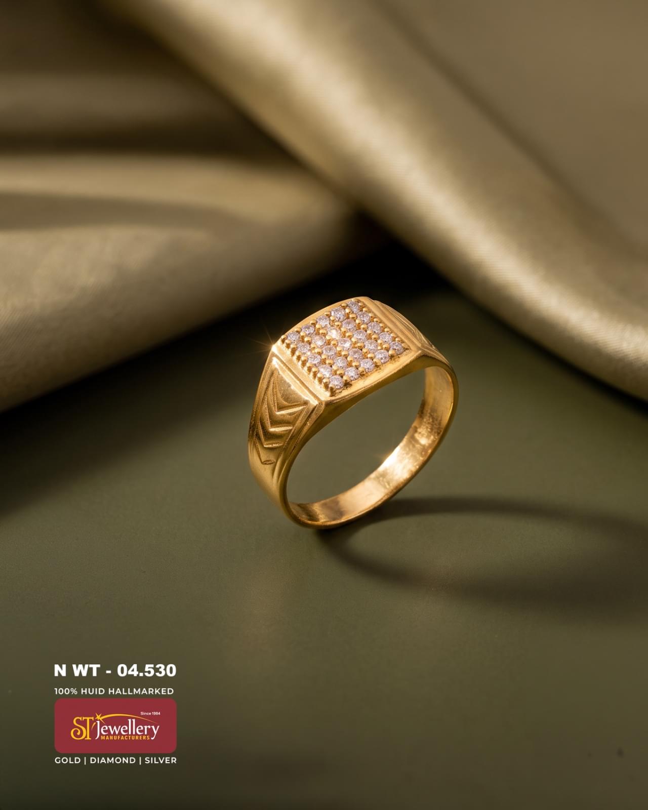 Men’s gold ring with a broad rectangular top featuring multiple clear stones and engraved geometric side detailing, ideal for special occasions and daily wear.