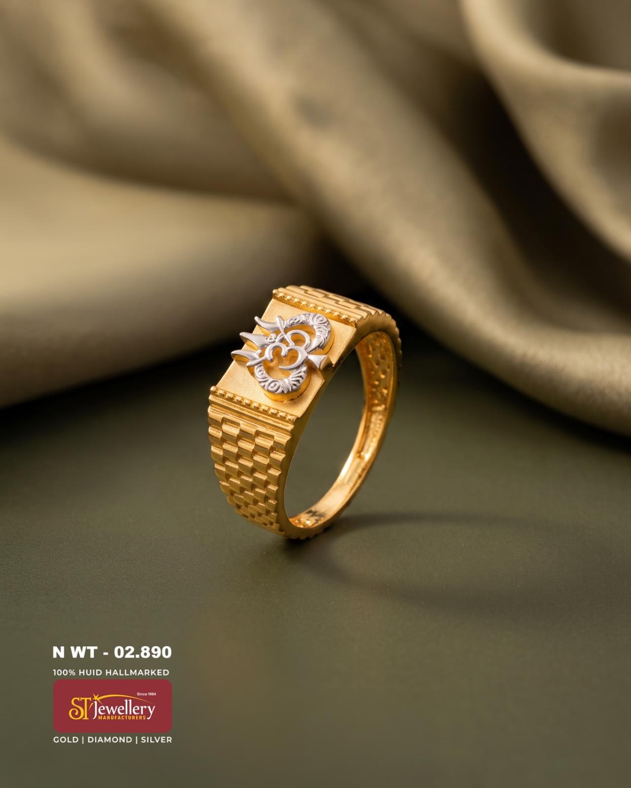 916 gold men’s ring featuring a prominent Om symbol in a contrasting white-metal finish, with a broad textured geometric band design.
